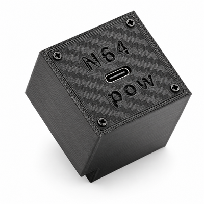 Black 3D printed N64 Pow USB-C power supply for the Nintendo 64, top view showing the carbon-fibre textured panel, embossed N64 POW logo and central USB-C port