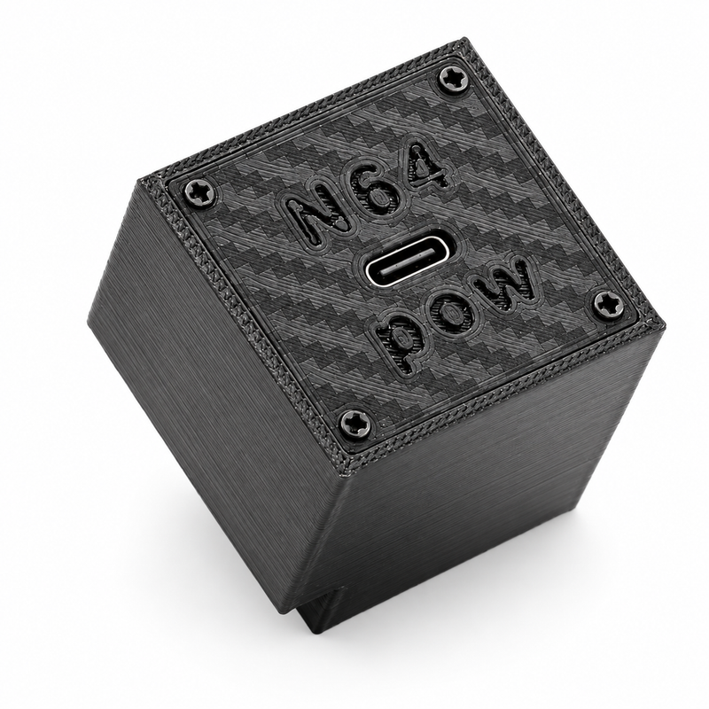 Black 3D printed N64 Pow USB-C power supply for the Nintendo 64, top view showing the carbon-fibre textured panel, embossed N64 POW logo and central USB-C port