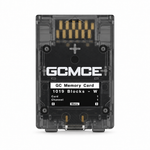 Smoke black FlipperMCE GCMCE GameCube memory card with translucent shell, showing the gold GameCube edge connector at the top and USB-C port at the bottom