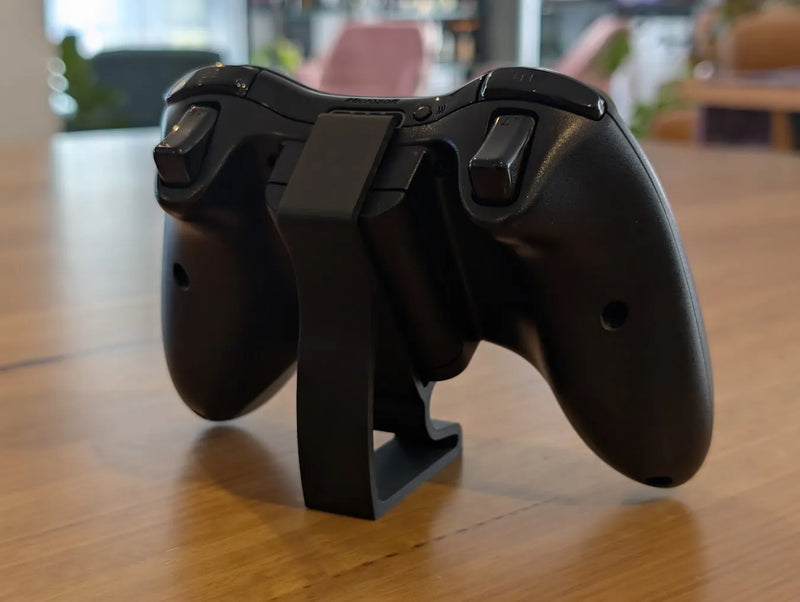 Rear view of the Xbox 360 controller display stand holding a controller